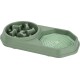 Gamelle pour animaux en plastique vert à alimentation lente avec un labyrinthe d'un côté et un tapis texturé de l'autre.