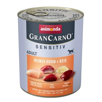 Nourriture pour chiens en conserve étiquetée 'GranCarno Sensitiv Adult' avec 'Reines Huhn + Reis' et des images de poulet et de riz, sans gluten, fabriquée en Allemagne.