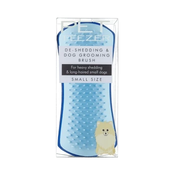 Blue de-shedding and dog grooming brush in packaging, labeled for heavy shedding and long-haired small dogs, featuring a cartoon dog.