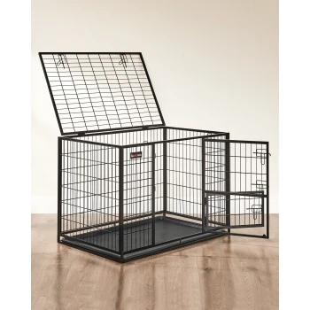 Schwarze Metall-Haustierbox mit offenem Oberteil und Seitentür, mit herausnehmbarem Bodentablett, auf einem Holzboden.