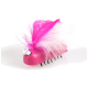 A whimsical pink pet grooming tool shaped like a bug, featuring large googly eyes and vibrant pink and white feathers on top.
