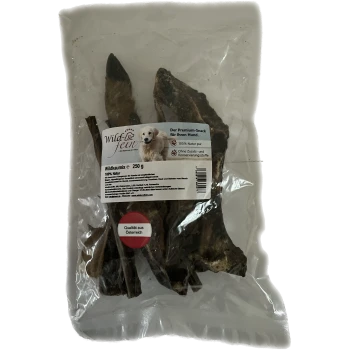 Paquet transparent de friandises pour chiens "Wild & fein" (250g) avec un golden retriever, étiqueté "100 % Natur pur" et "Qualität aus Österreich."