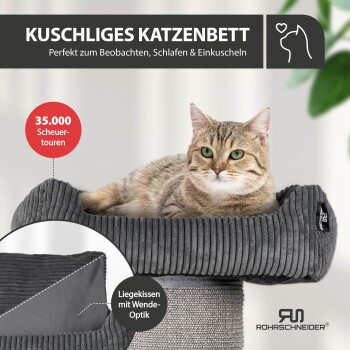 Graues Cordstoff-Katzenbett und Kissen neben einer Waschmaschine; sichtbarer Text: „MASCHINENWASCHBAR“ und „30°C waschbar“.