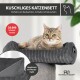 Graues Cordstoff-Katzenbett und Kissen neben einer Waschmaschine; sichtbarer Text: „MASCHINENWASCHBAR“ und „30°C waschbar“.
