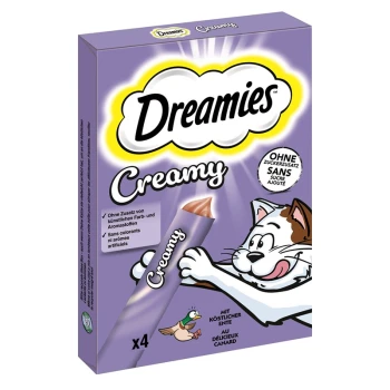 Verpackung von Dreamies Creamy Katzenleckerlis mit einer verspielten Katze und einer Ente, mit Text, der "ohne künstliche Farben" und "mit köstlicher Ente" hervorhebt.