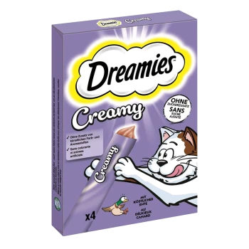 Verpackung von Dreamies Creamy Katzenleckerlis mit einer verspielten Katze und einer Ente, mit Text, der "ohne künstliche Farben" und "mit köstlicher Ente" hervorhebt.