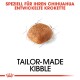 Bild eines Kibble-Stücks mit dem Text "MADE-TO-MEASURE KIBBLE" und "SPEZIELL FÜR IHREN CHIHUAHUA ENTWICKELTE KROKETTE" darüber.