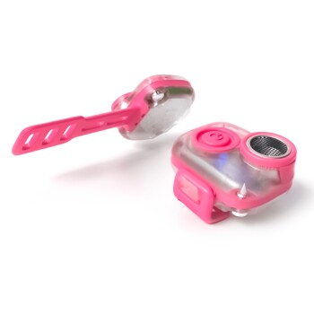 Pinkfarbener Haustier-Trainingsklicker mit Handgelenkschlaufe und Knopf vor weißem Hintergrund.