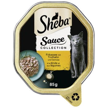 Karma dla kotów Sheba Sauce Collection w pojemniku 85g, z frikassee z indykiem i warzywami, z obrazkiem szarego kota na etykiecie.