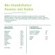 Bio-Hundefutterpaste mit Huhn, die Zutaten und Nährwertinformationen auflistet, einschließlich Protein, Vitaminen und Mineralien.