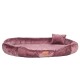 Plüsch, rundes Haustierbett in einem weichen Mauve-Ton mit einem kleinen passenden Kissen, mit einem "tierlando"-Logo-Tag.