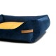 Navyblaues Haustierbett mit einem weichen gelben Zentrum und einem Lederetikett mit der Aufschrift 'RexProduct.com'.