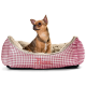 Ein gemütliches Hundebett mit einem rosa-weißen Karomuster, mit einem weichen, plüschigen Innenraum. Der Markenname "HUNTER" ist auf der Seite gestickt.