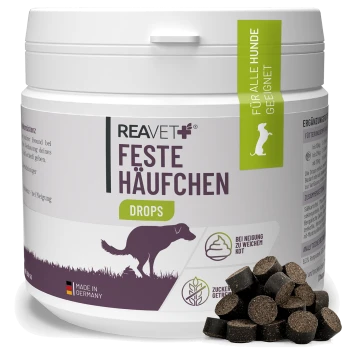Behälter mit REAVET Feste Häufchen Drops für Hunde, hergestellt in Deutschland, mit Hundesilhouette und deutschem Text.