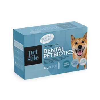 Blaue Schachtel des Petstile Dental Petbiotics Hundesupplements mit einem lächelnden Hund und Text, der gesunde Zähne, Antioxidantien und natürliche Inhaltsstoffe hervorhebt.