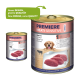 Dosen von PREMIERE MEATI SENSITIVE Hundefutter, mit einem Golden Retriever, mit Text, der "Neues DESIGN, gleiche QUALITÄT" und "Rind Pur" (Reines Rindfleisch) hervorhebt.