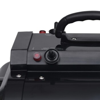 Nahaufnahme eines schwarzen Haustierpflegewerkzeugs mit einem Geschwindigkeitsregler, einer roten Stromanzeige und einem Griff für einfache Handhabung.