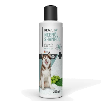 Flasche REAVET Neemöl Shampoo für Hunde, mit einem lächelnden sibirischen Husky, mit dem Hinweis auf pH 7.0 und 250ml Volumen.