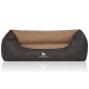 Ein stilvolles Hundebett mit einem dunkelgrauen Äußeren und einem weichen, gerippten beige Innenraum, mit dem Logo "KNUFFELWUFF" deutlich angezeigt.