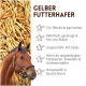 Nahaufnahme eines Haufens goldener Haferkörner, häufig als Tierfutter oder Futtermittel verwendet.