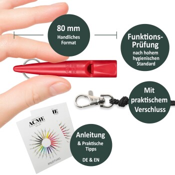 Hand hält rote 80 mm ACME-Pfeife mit Schlüsselring, Lanyard-Clip und Bedienungsanleitungen in Deutsch und Englisch.