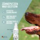 Nahaufnahme des Hundemauls mit herausgestreckter Zunge neben dem REAVET DentaVital-Spray, das die Zahnreinigung und frischen Atem fördert.