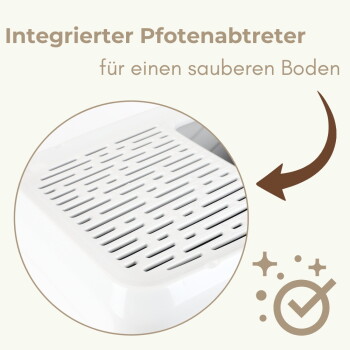 Nahaufnahme einer weißen, geschlitzten Pfotenreinigungs-Schale; sichtbarer deutscher Text: 'Integrierter Pfotenabtreter für einen sauberen Boden'.