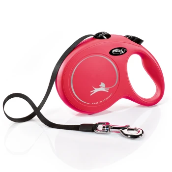 New Classic Gurt rot L, 5 m, 50 kg Eine leuchtend pinke, einziehbare Hundeleine mit einem schwarzen Riemen, mit einer silbernen Silhouette eines Hundes und dem Text 'MADE IN GERMANY.'
