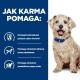 Jasny pies w niebieskiej obroży siedzi na niebieskim tle z tekstem o korzyściach z karmy dla psów, takich jak kontrola poziomu cukru we krwi i zdrowa waga.
