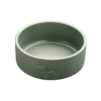 Grüner Keramik-Hundebehälter mit einer subtilen Hundesilhouette, die auf die Seite geprägt ist.