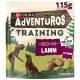 Purina AdVENTuROS Training-Lamm-Hundesnack im Beutel 115 g; Silhouetten von Mensch und Hund; Text 'Reich an Lamm', 'Fettarm'.