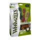 Whimzees Natural Dog Treats package with three toothbrush-shaped treats in green, red, and beige. Labels: "Vegetarian," "Gluten Free," "Dental Care."