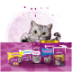 Eine verspielte graue Katze schaut hinter bunten Whiskas-Produkten hervor, mit "Probiere unser Sortiment" darüber.