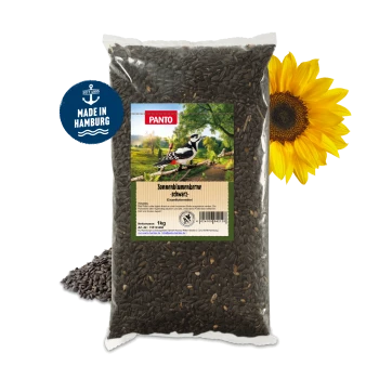 Ein 1-kg-Beutel mit schwarzen Sonnenblumenkernen, beschriftet mit 'Sonnenblumenkerne - schwarz', mit einer Specht-Illustration und grünem Landschaftshintergrund.