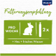 Recommandation alimentaire pour les lapins : 2 friandises par semaine, plus du foin et de l'eau fraîche. Marque Vitakraft visible en haut.