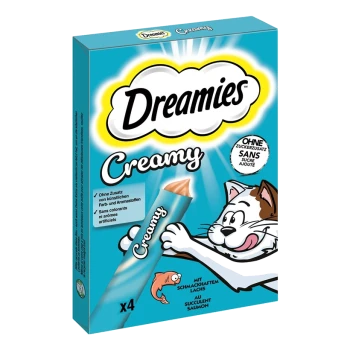 Emballage de friandises crémeuses pour chats Dreamies avec un chat de dessin animé tenant une friandise crémeuse, avec un texte indiquant "x4" et des saveurs comme le saumon.