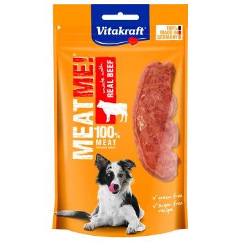 Helle orange Verpackung für Vitakraft's "MEAT ME!" Hundesnack mit echtem Rindfleisch, mit einem verspielten Hund und Hinweisen zur Qualität.