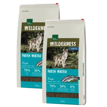 Two 12 kg bags of Real Nature Wilderness dog food for adults, labeled with a wolf and featuring "70% Fish, 30% Vegetables."