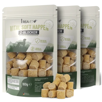 Drei braune Beutel Reavet Vital Soft Happen Z-Blocker Haustiersnacks mit sichtbaren Würfeln und deutschem Text.
