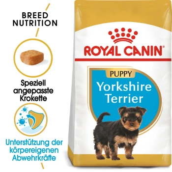 Royal Canin Welpen Yorkshire Terrier Hundefutterbeutel mit einem kleinen Yorkshire Terrier Welpen, mit Text, der die Rassenernährung und Immununterstützung hervorhebt.