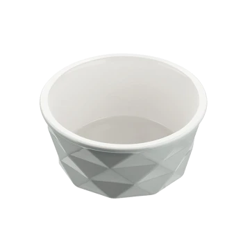 Graue geometrische Futterschüssel für Haustiere mit glänzendem weißen Innenraum, mit facettiertem Design.