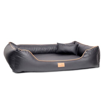 Schwarzes Haustierbett mit einem gesteppten Innenraum und einem kleinen passenden Kissen, ausgestattet mit einem beigen Rand und einem Logo-Patch auf der Vorderseite.