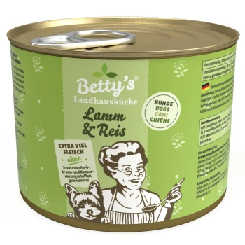 Dose von Betty's Landhausküche Hundefutter, beschriftet mit "Lamm & Reis," mit einem grünen Design, einer Frau mit einem Löffel und einer Hundillustration.