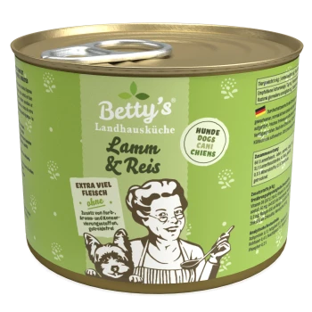 Dose von Betty's Landhausküche Hundefutter, beschriftet mit "Lamm & Reis," mit einem grünen Design, einer Frau mit einem Löffel und einer Hundillustration.