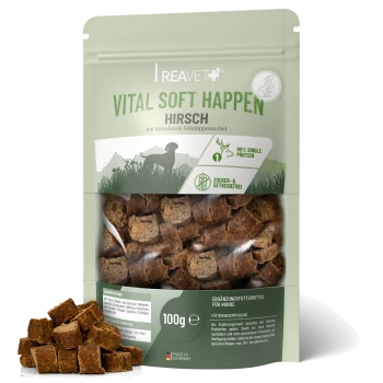Eine Packung REAVET Vital Soft Happen Hundeleckerlis, mit einem Hundebild und den Texten "monoprotein" und "Waldhirsch" auf Deutsch.