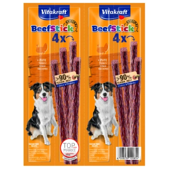 Beef-Stick 2x4 Stk. Pute Vitakraft BeefStick Verpackung mit vier Fleischsticks und einem Hund auf jeder Seite. Höhepunkte: "90% Fleisch," "zuckerfrei," "extra Vitamine."