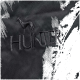 Schwarzer Stoff mit einem gestickten Logo eines Windhundes und dem Wort 'HUNTER' in fetten Buchstaben.