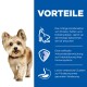 Ein Hund auf einem blauen Hintergrund mit Text über Proteine, Antioxidantien für die Immunität und verdauliche Zutaten für eine gesunde Verdauung.
