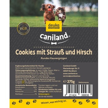 Hundeleckerlipaket, das zwei Hunde zeigt, die mit einem Ball spielen. Auf dem Etikett steht "Caniland Cookies mit Strauß und Hirsch," mit Angaben zu Zutaten und Nährstoffen.