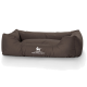 Braunes Hundebett mit erhöhten Seiten und einem weichen Kissen, mit dem Logo "KNUFFELWUFF" deutlich sichtbar.